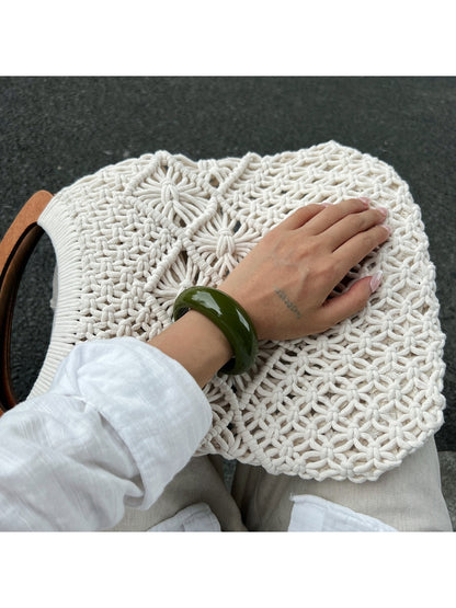 Side view of Lovra open cuff bracelet showing its curved design