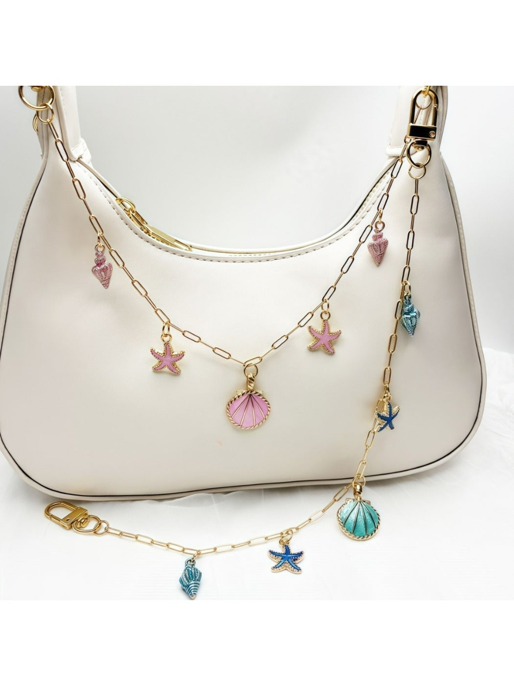 Keypus marine charm bag charm displayed hanging from a handbag handle