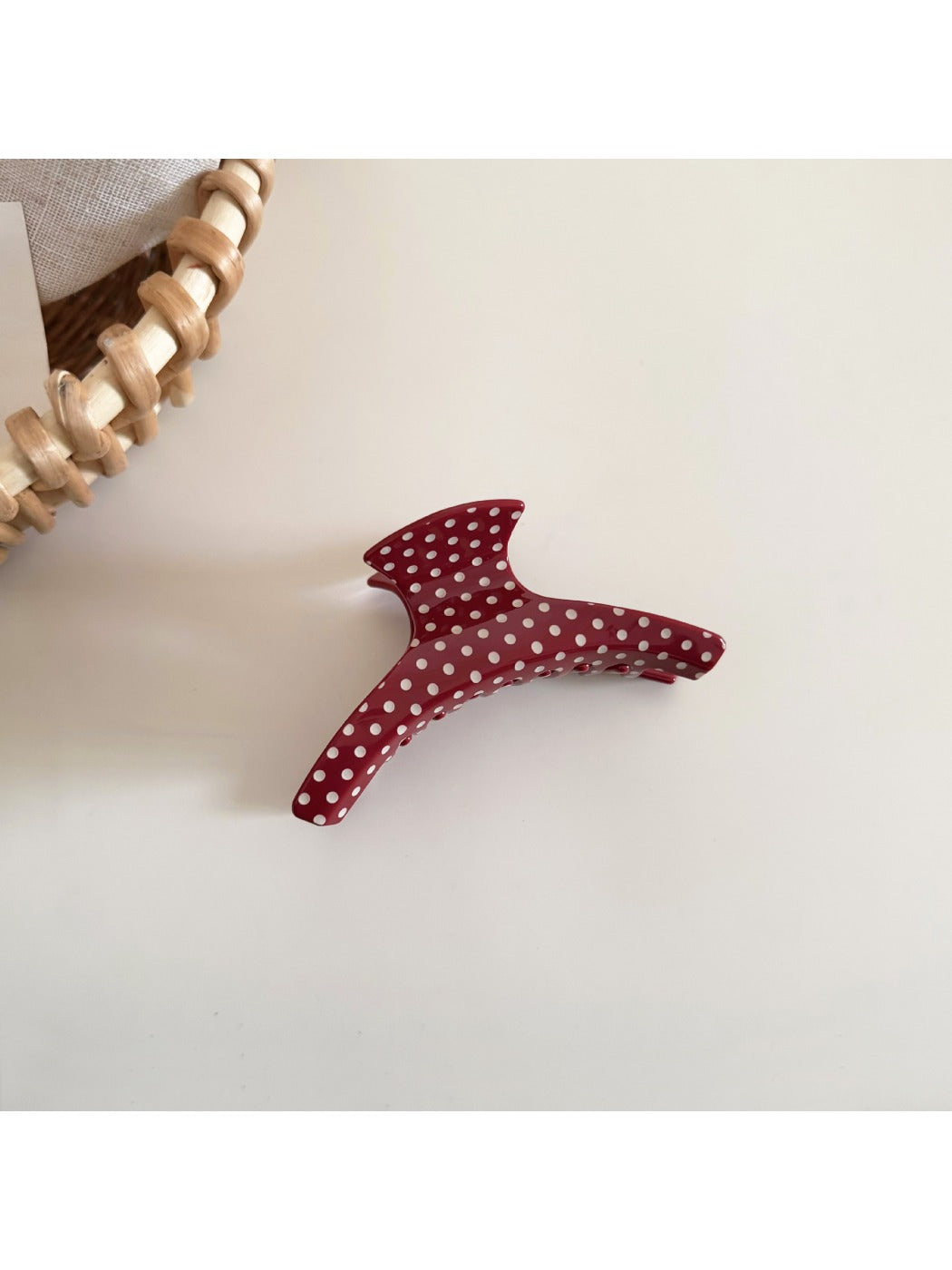 Side view of Beau polka dot acetate hair clip highlighting thickness and clasp mechanism