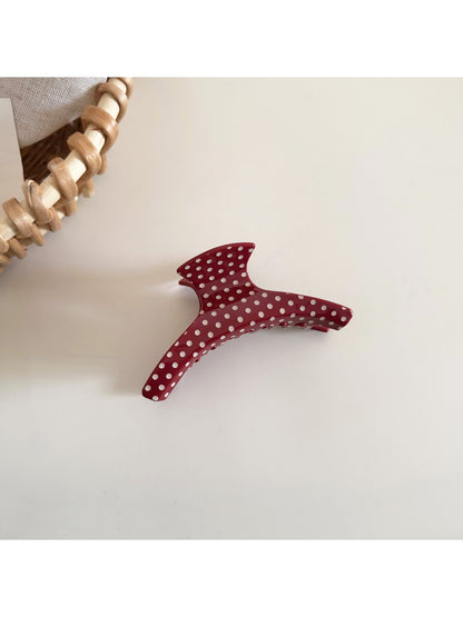 Side view of Beau polka dot acetate hair clip highlighting thickness and clasp mechanism