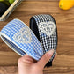 Gifty plaid bow print headband displayed on a white background