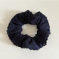 Gifty scrunchie packaged in branded box with clear view of product