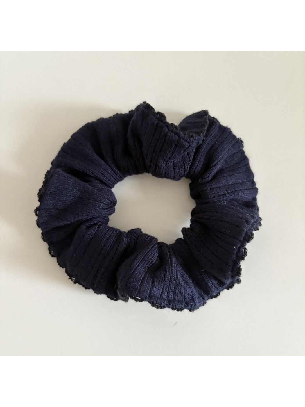 Gifty scrunchie packaged in branded box with clear view of product