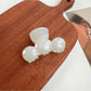 Beau hair claw clip displayed with packaging box and branding