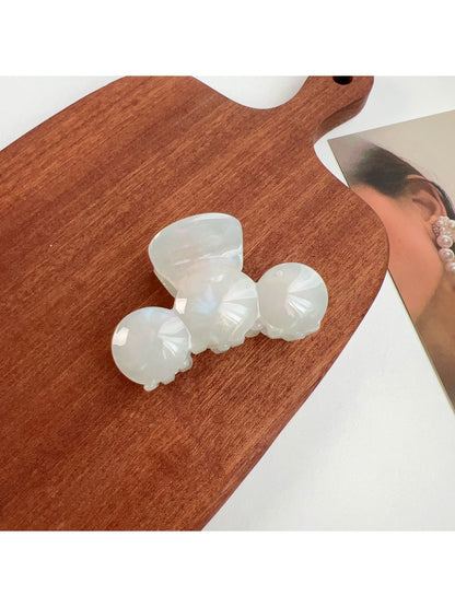 Beau hair claw clip displayed with packaging box and branding