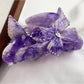 Beau colorful butterfly hair claw clip angled to show depth and texture