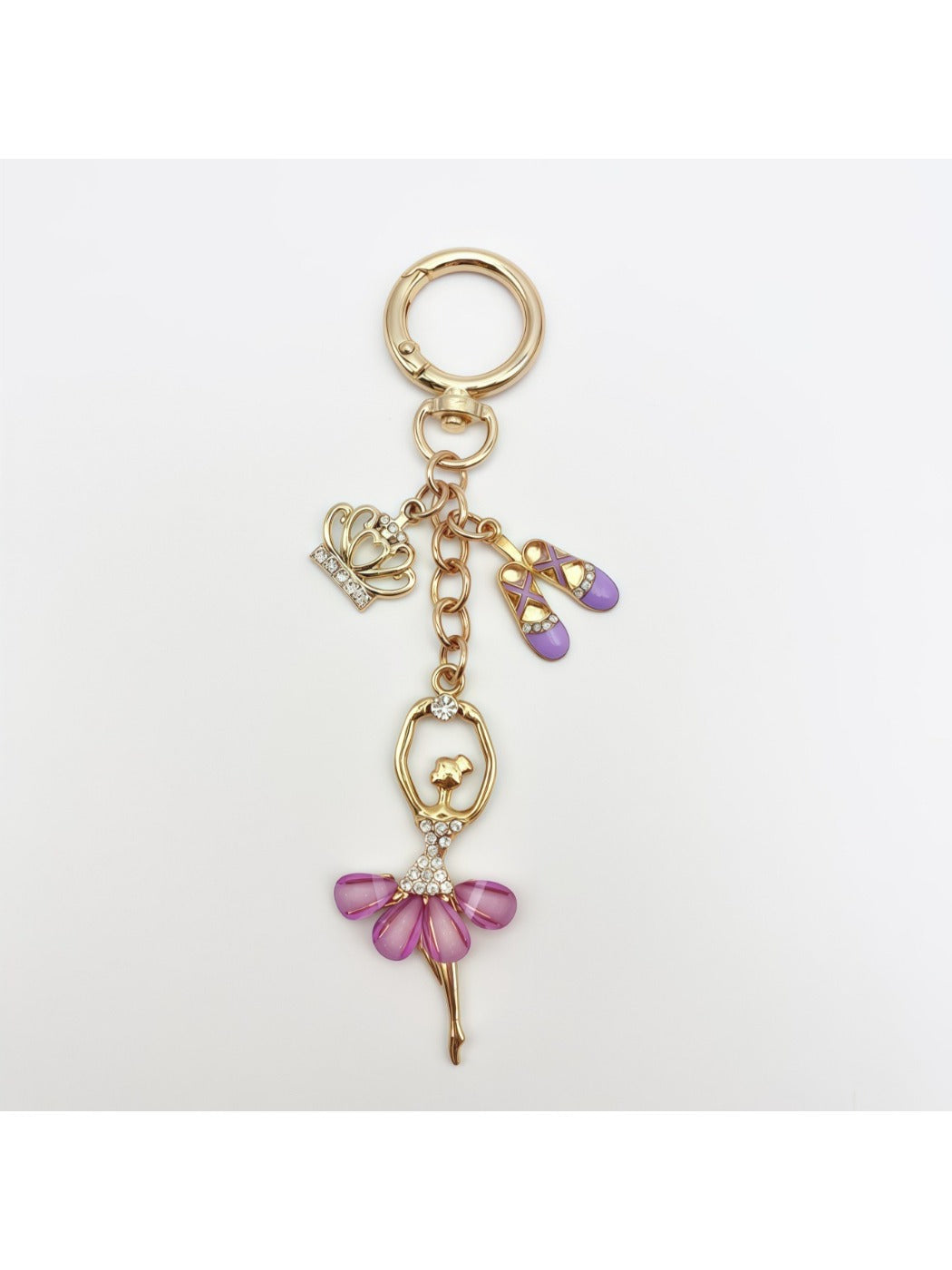 Side view of ballerina charm keychain highlighting the gold-tone clasp