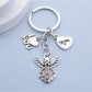 Side view of shiny alloy angel keychain showing smooth finish