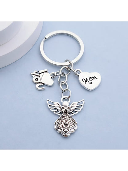 Side view of shiny alloy angel keychain showing smooth finish