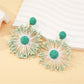 Sweet Flower Firework Shaped Earrings hanging on a display stand