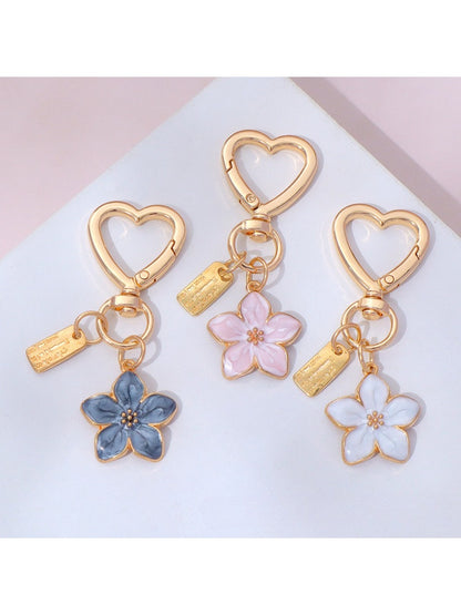 Close-up of Keypus stylish floral charm keychain with pink and white flowers