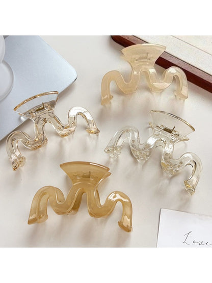 Beau hair claw clip open to display spring mechanism and teeth