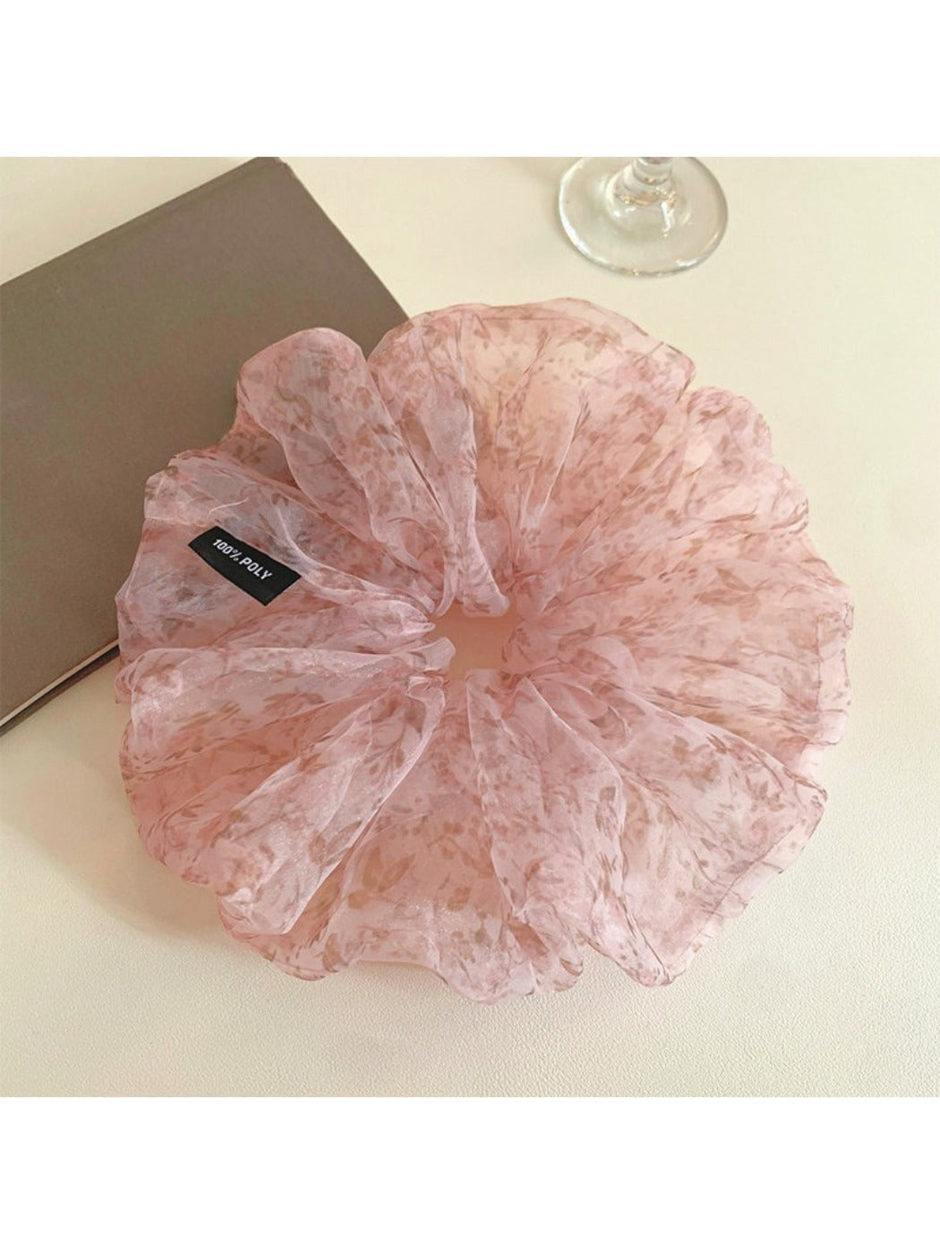 Close-up of pink tulle scrunchie showing delicate tiny floral details
