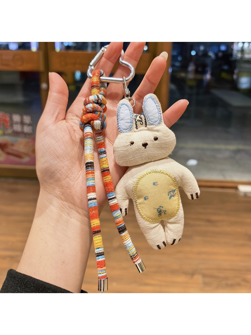 Side view of Keypus bunny charm highlighting its rounded shape and smooth finish