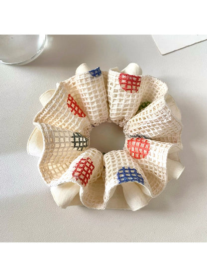 Close-up of Gifty Lazy Style polka dot scrunchie showing fabric texture and elastic band