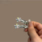 Close-up of a single vibrant hair clip with a sleek minimalist design