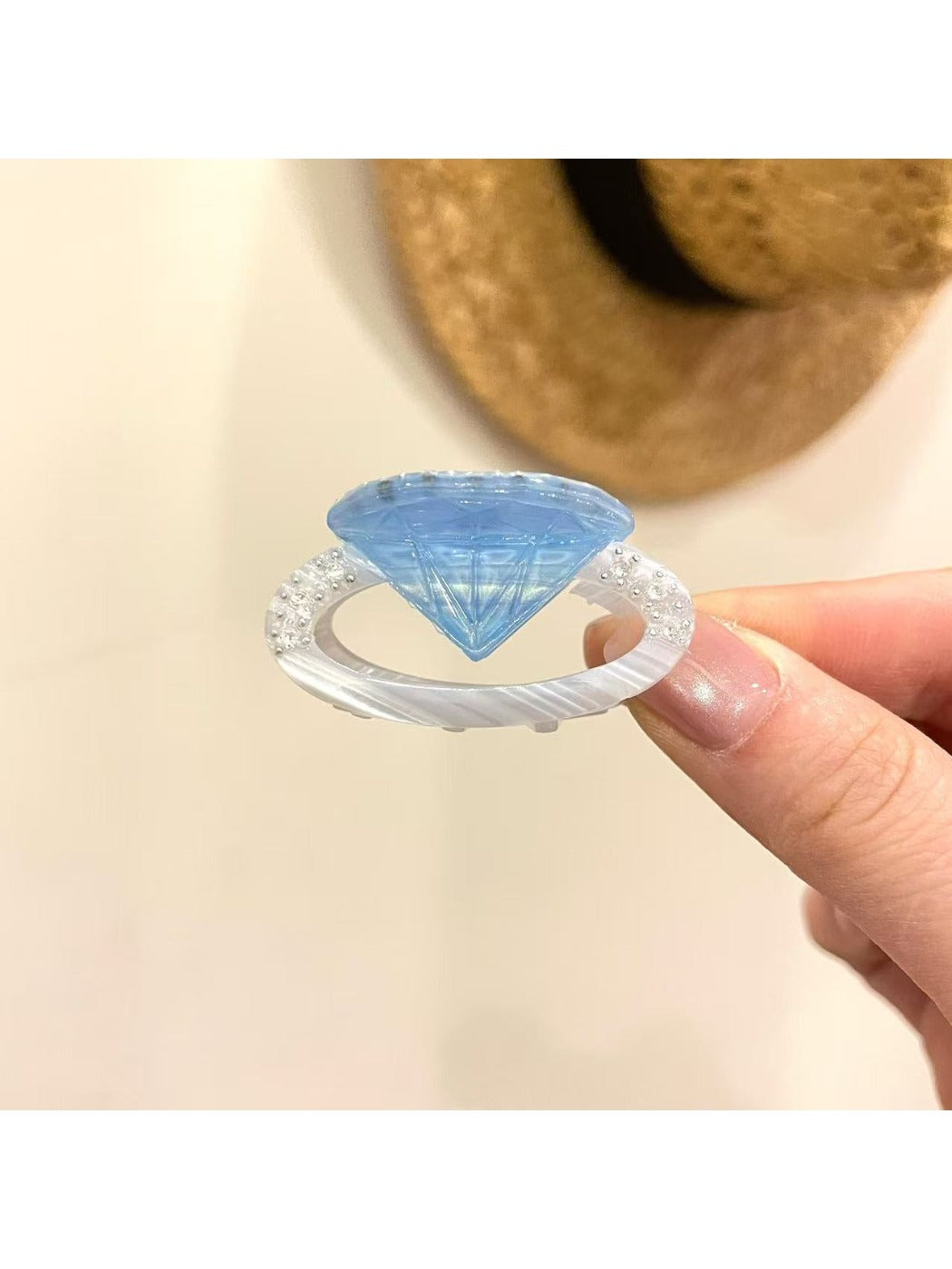 Beau ring shape claw clip styled in hair, securing a bun