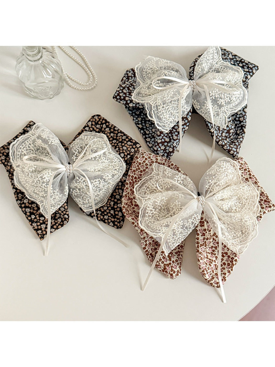 Beau tiny floral lace bow claw clip on white background