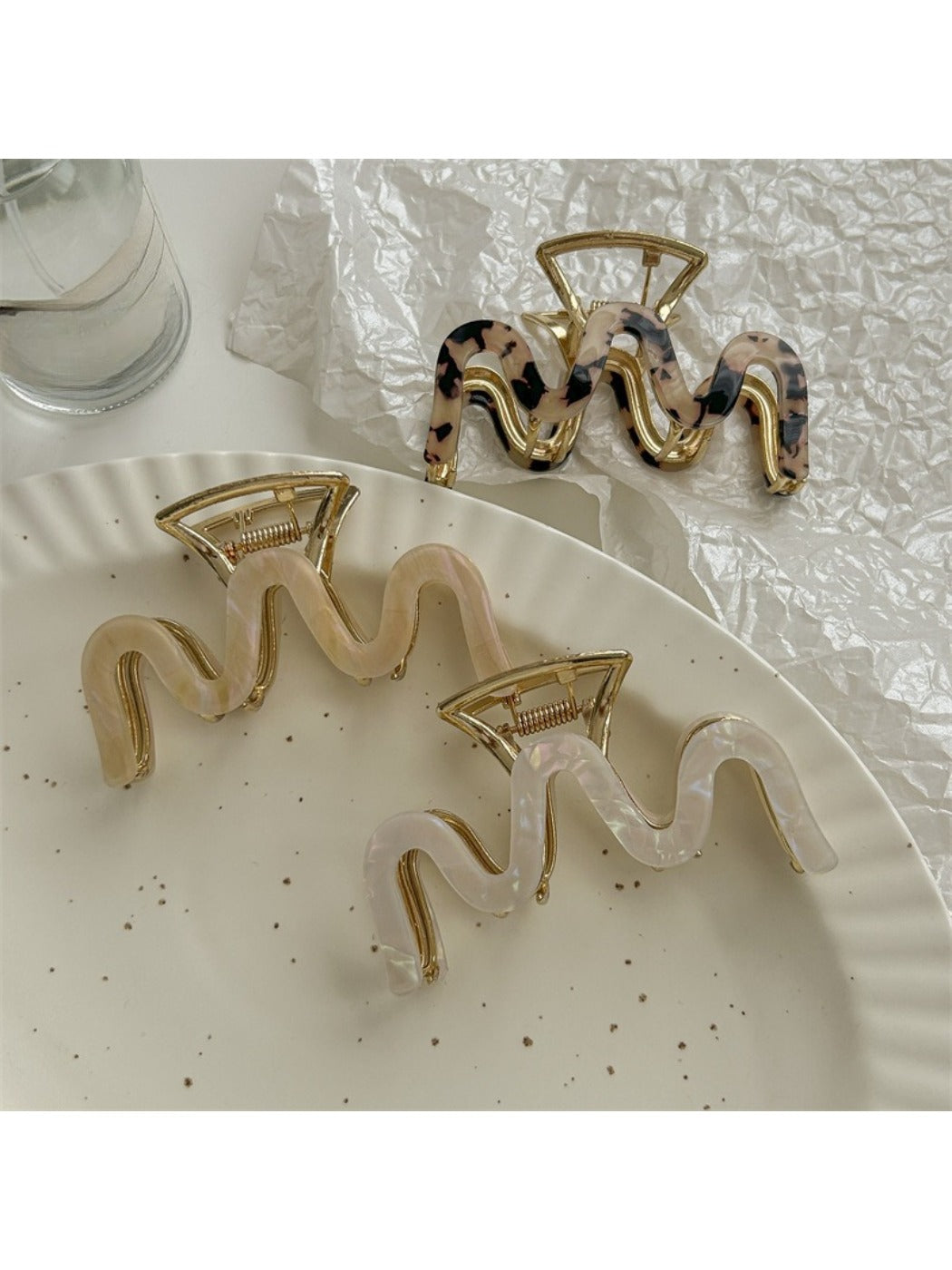 Beau vintage wave line claw clip held in hand to show size and shape