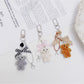 Side view of Keypus flocked bear bag charm highlighting its plush design