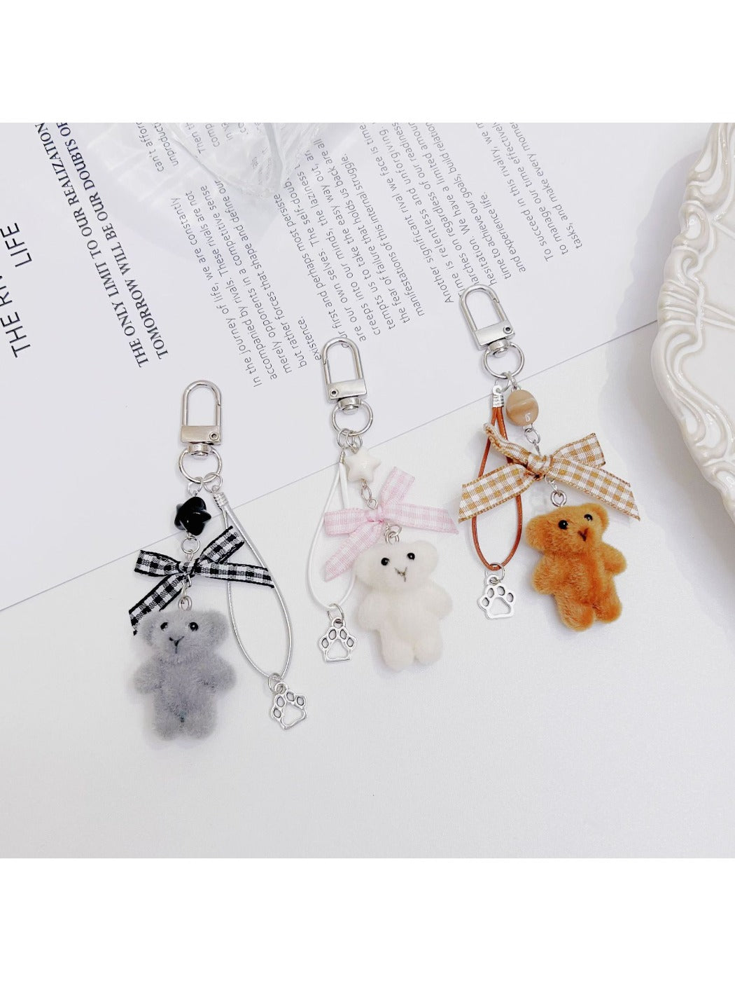 Side view of Keypus flocked bear bag charm highlighting its plush design