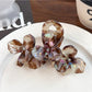 Beau elegant floral hair claw clip styled in long brown hair from back view