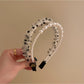 Vintage tulle headband displayed on white background highlighting fabric texture
