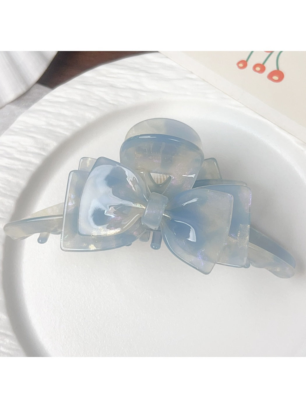 Beau double layer bow hair claw clip styled in hair on model