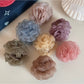 Beau hair clip showing detailed rose petals from side angle