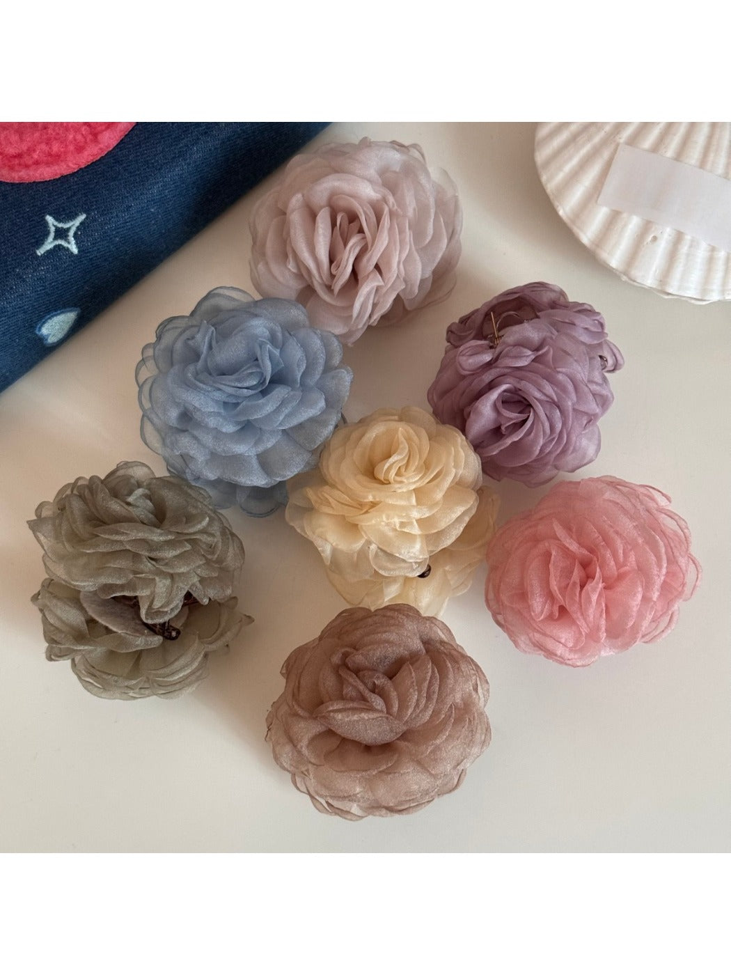 Beau hair clip showing detailed rose petals from side angle
