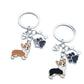 Puppy keychain hanging from a set of keys against a white background