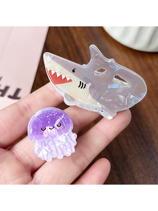 Beau colorful claw clip with shark and octopus print on a white background