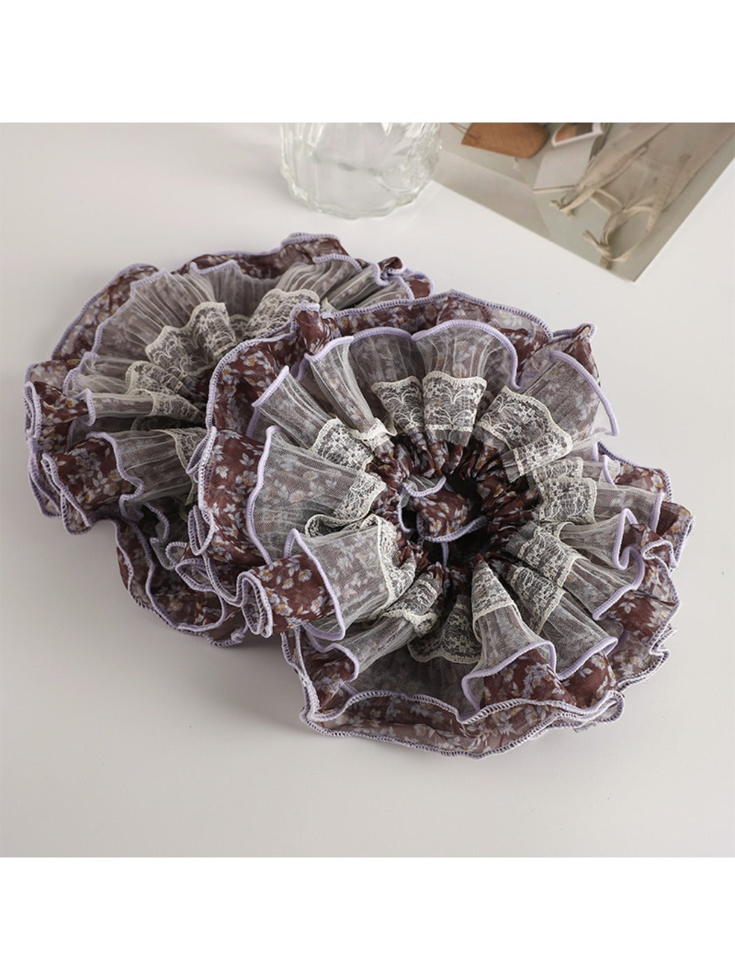 Vintage purple floral scrunchie displayed on a white background showing full circular shape