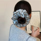 Close-up of blue polka dot fabric texture on headband