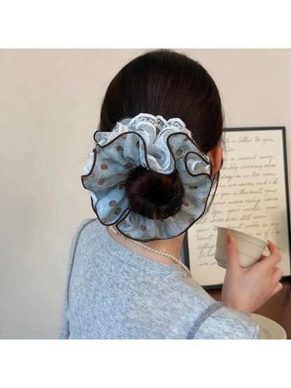 Close-up of blue polka dot fabric texture on headband