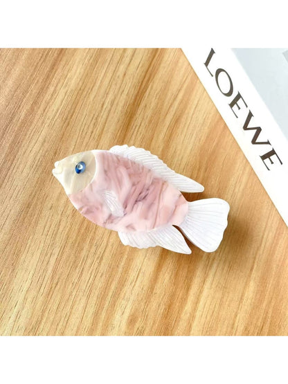Beau fish shaped hair claw clip open showing metal spring mechanism