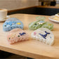 Beau Coastal Ocean Series acetate hair clip with blue and green ocean-inspired pattern