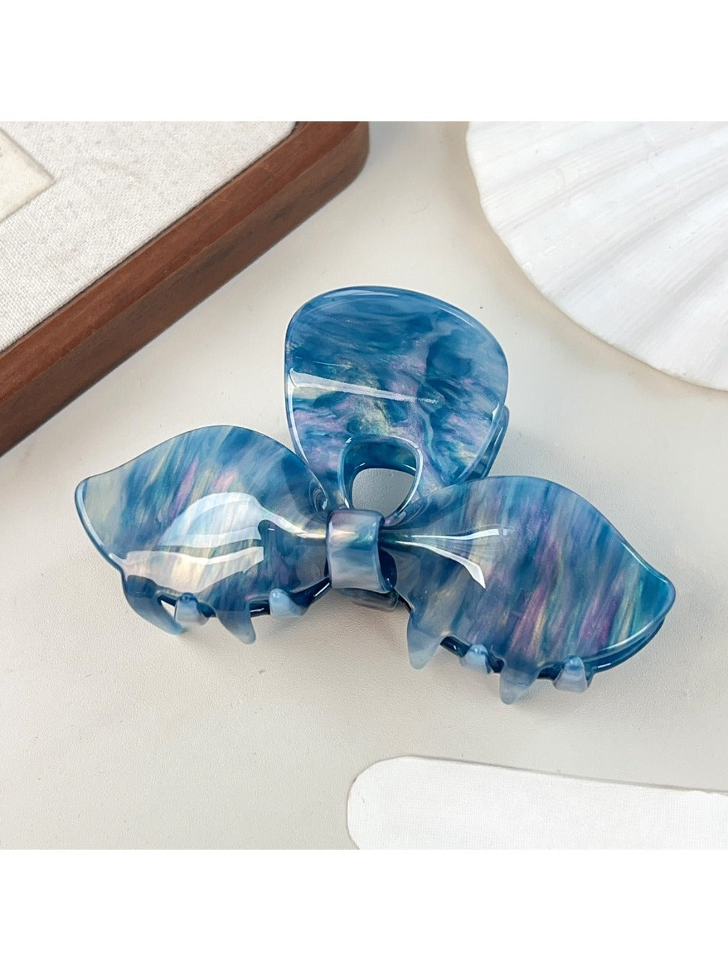 Beau bow hair claw clip displayed with matching hair accessories