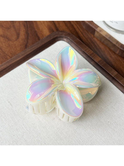 Beau flower shaped claw clip with petals spread open on white background