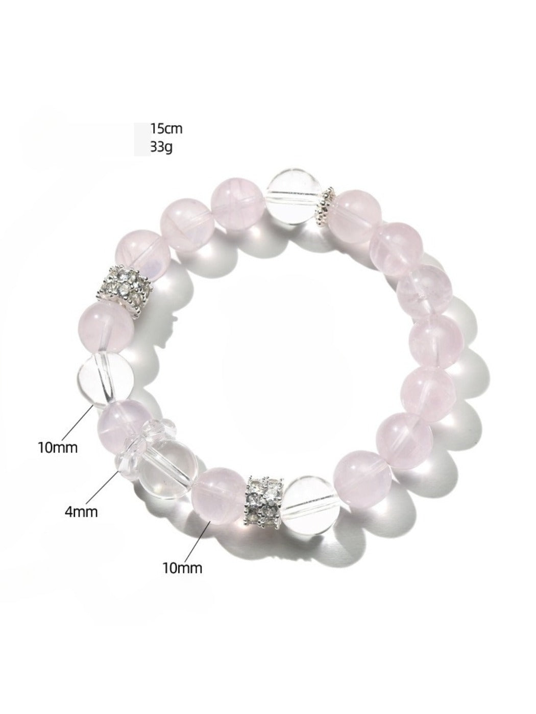 Lovra pink and white crystal beaded bracelet coiled on a reflective surface