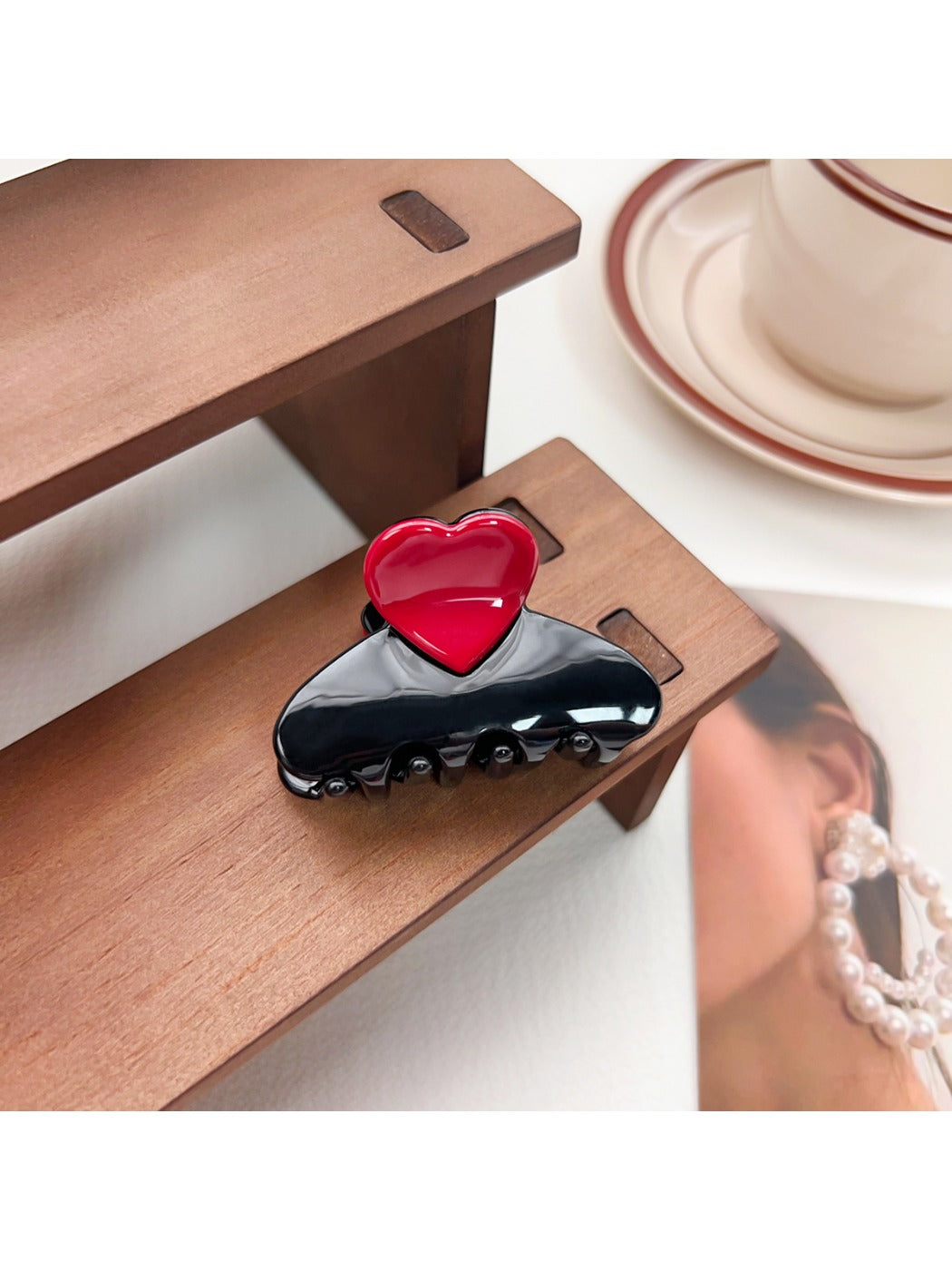 Beau medium heart shaped half circle claw clip shown from top angle on white background
