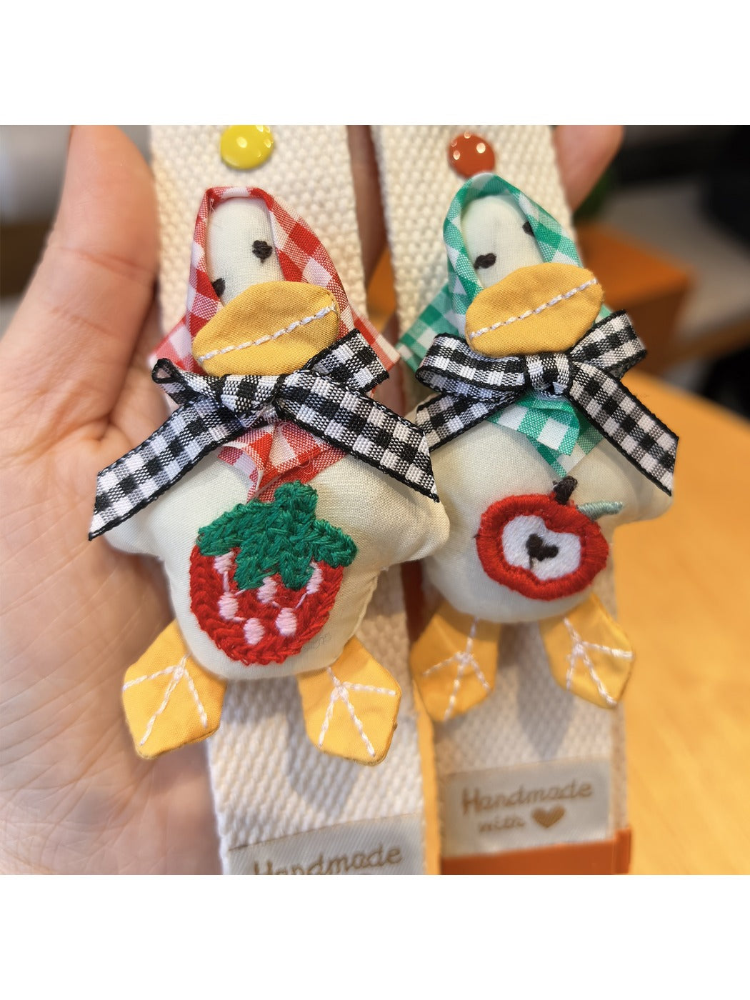 Keypus duck charm keychain attached to a backpack zipper pull