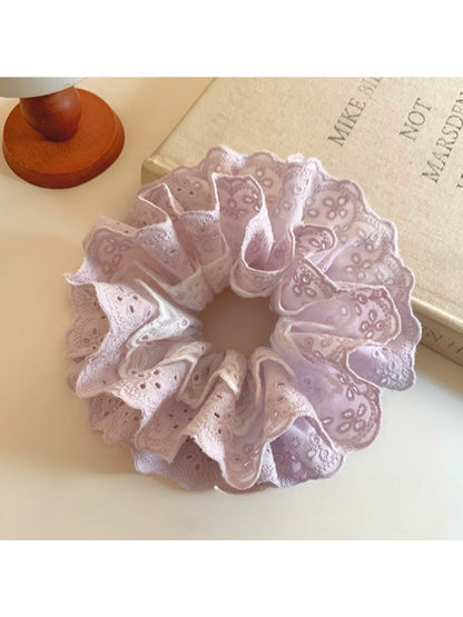Sweet purple double scrunchie with cutout design on a white background