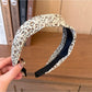 Wide vintage print headband folded flat displaying full pattern and colors
