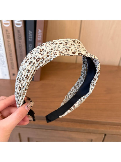 Wide vintage print headband folded flat displaying full pattern and colors