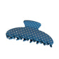 Beau acetate hair clip with vibrant polka dots displayed against a pastel background