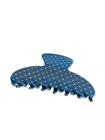 Beau acetate hair clip with vibrant polka dots displayed against a pastel background