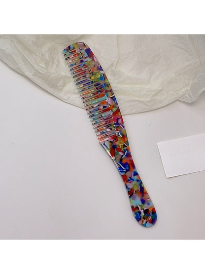 Camerow long handle hair comb with teeth partially embedded in hair strands
