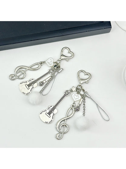 Close-up of Keypus music note keychain showing detailed musical note charm on silver keyring