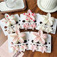 Beau flower shaped claw clip in pastel pink on white background